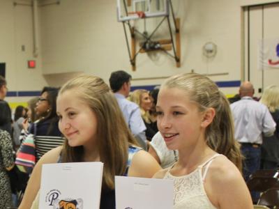 Rocky Run NJHS students celebrate receiving their pins and certificates