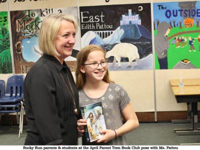 Edith Pattou takes a picture with a student after discussion of her book "East" at Parent Teen Book Club